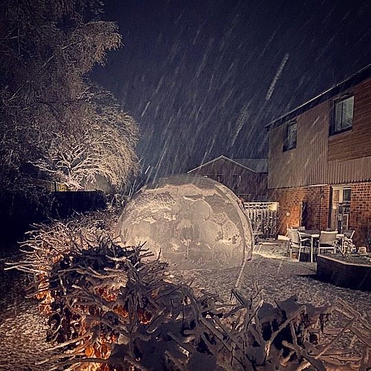 Transparent garden igloo dome in the rain
