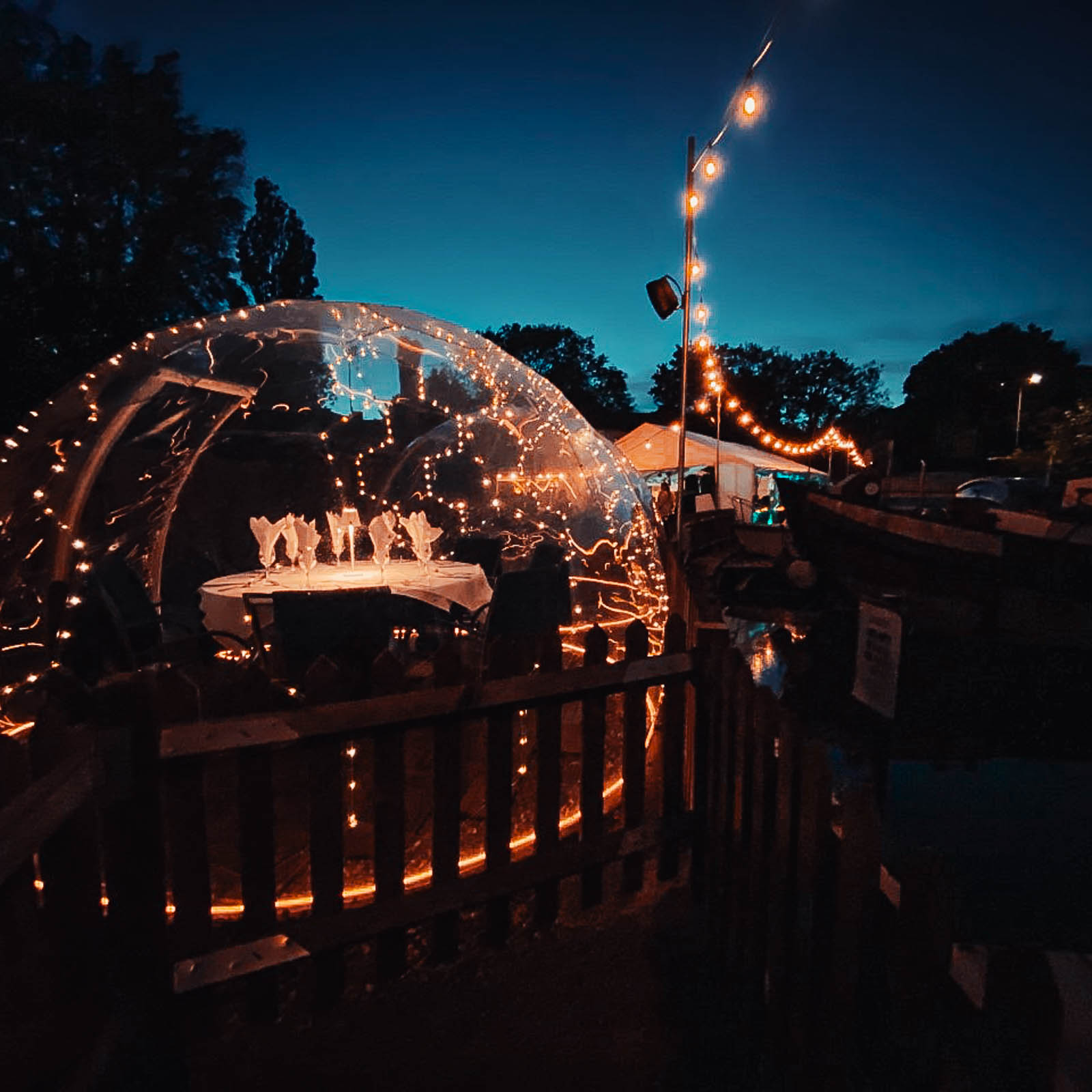 Illuminated dining domes by night