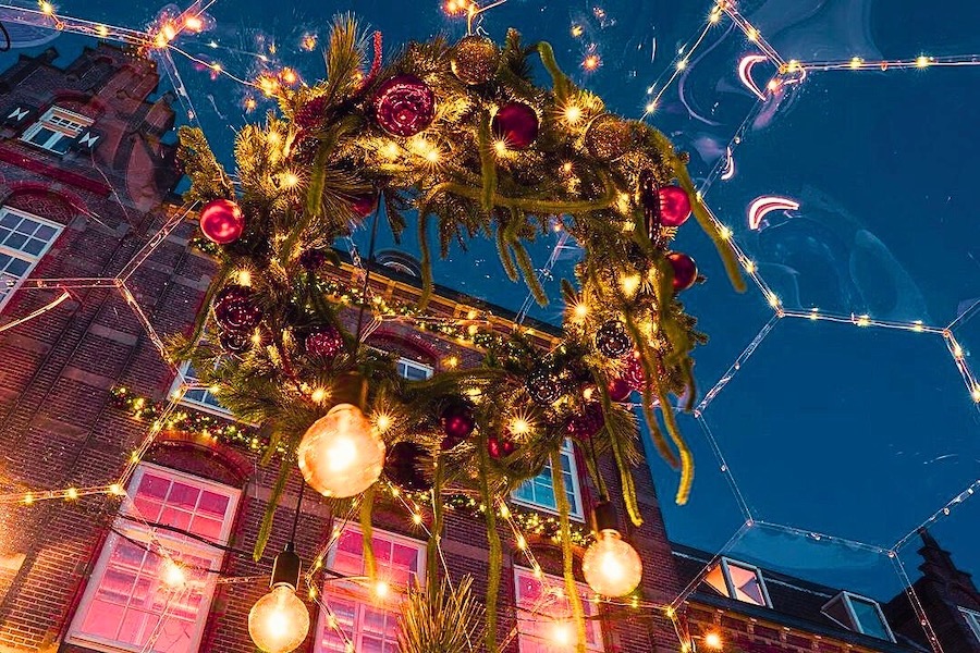 A Christmas wreath hanging under the dining pod's ceiling