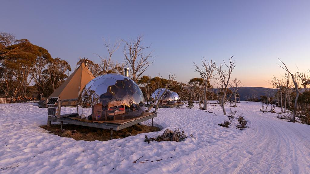 A glamping setting in a winter scenery with insulated glamping domes