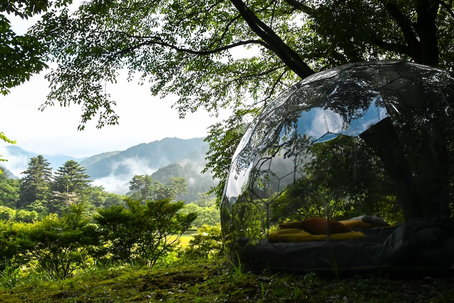 A glamping dome in a Japanese forest