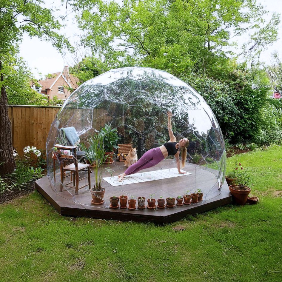 a woman practicing yoga outdoors in a dome